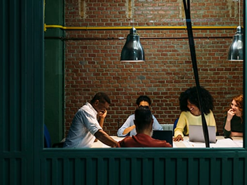Business Group In A Meeting Room In The Office Team at work. Group of business people working and communicating together in creative office.
